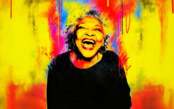 A joyful older woman with curly gray hair laughs brightly, surrounded by a vibrant background of yellow, red, and blue, creating an energetic, colorful, and uplifting atmosphere.