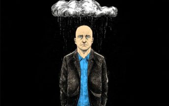 A sad, bald man in a blue shirt and dark jacket stands under a small rain cloud, with rain falling only on him against a black background.