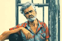 A stern-looking older man with gray hair and a beard sits by a window, wearing a colorful patterned shirt. His expression is serious, and his posture is relaxed with one arm resting on his knee. The background is muted.