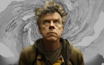 A man with curly hair and a serious expression looks upward, standing in front of a swirling, abstract, black-and-white background resembling a vortex. He wears layered jackets and a plaid shirt.