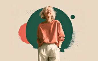 A smiling older woman with short white hair, wearing a loose coral sweatshirt and light pants, stands confidently against a background with abstract green and coral shapes.