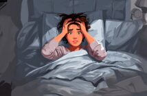 A person with wide eyes and a distressed expression sits up in bed, gripping their hair in fear or anxiety. The room is dimly lit, suggesting a nighttime or unsettling atmosphere.