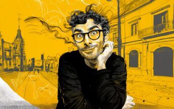 A curly-haired person with glasses and a playful expression rests their chin on their hand. The background is a vibrant, yellow-toned city street illustrated in a sketchy style.