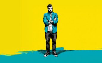 Illustration of a man with a beard, wearing a blue shirt, white t-shirt, jeans, and sneakers, standing with arms crossed. The background is half yellow, half teal, with a painted, artistic effect.