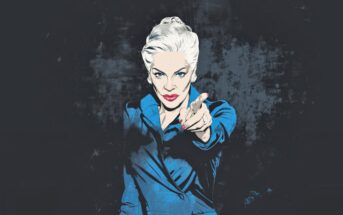 Illustration of a woman with white hair styled back, wearing a blue suit, pointing directly at the viewer with a stern expression. The background is dark and textured.