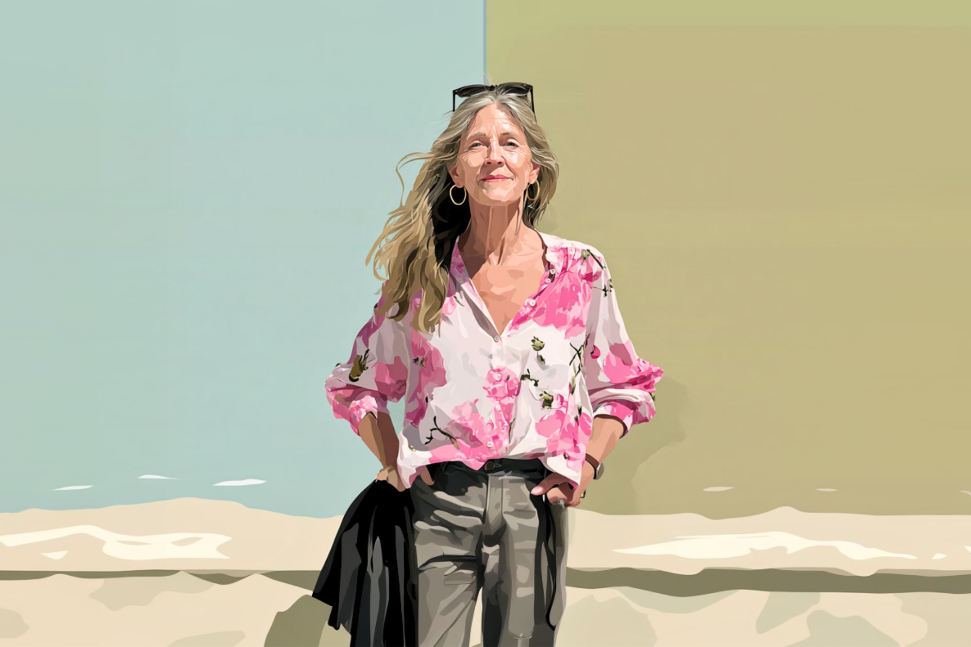 A woman with long blonde hair stands smiling in front of a split pastel background, wearing a pink floral blouse, gray pants, and sunglasses on her head. Her hands are in her pockets.