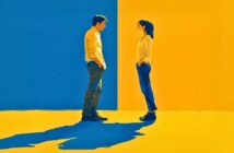 A man and woman stand facing each other, casting long shadows, against a split background of blue and yellow. Both wear casual clothes in neutral tones, with the man on the blue side and the woman on the yellow side.