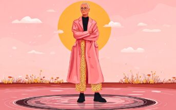 An elderly person with short hair and glasses stands confidently on a circular platform, wearing a long pink coat and yellow polka-dot pants, set against a pink landscape with a large yellow sun.