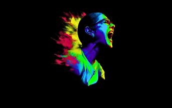 A stylized digital artwork of a person screaming, with vibrant neon colors—blue, green, yellow, and red—exploding behind them against a black background. The person wears glasses and their expression is intense.