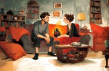 A man and a woman sit on a couch in a cozy, warmly lit living room, talking seriously. The woman holds a dark vase. Bookshelves, a lamp, and a fireplace with a glowing fire decorate the background.