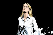 Illustrated image of a woman with blonde hair wearing a white shirt, looking upward with a serious expression against a solid black background with white splatters near the bottom.