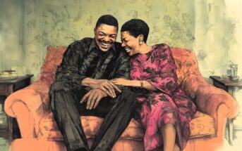 A joyful couple sits close together on an orange sofa, laughing and holding hands. The man wears a dark shirt and the woman wears a bright floral dress. They appear happy and relaxed in a cozy living room.