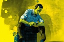 A digital illustration of a man sitting on a box, looking down at his wristwatch with a serious expression. The image uses blue and yellow tones, with abstract shapes in the background.