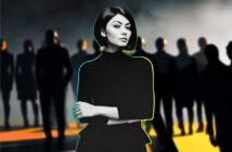 A confident woman with short dark hair stands in the foreground, arms crossed, with a blurred group of people behind her in a dramatic, shadowy setting.