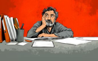 Illustration of a bearded man sitting at a cluttered desk, resting his head on his hand and looking up thoughtfully. The background is bright red and there are scattered papers, folders, and stationery on the desk.