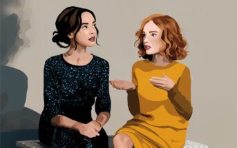 Two women sit on a bench having a conversation. One wears a dark blue patterned dress with her hair up, and the other wears a yellow dress with curly red hair, gesturing with her hands as she speaks.