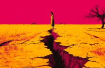 A woman stands at the edge of a deep crack in dry, yellow earth under a vivid pink sky, with a barren tree to the right and sparse vegetation in the background.