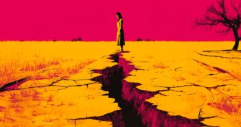A woman stands at the edge of a deep crack in dry, yellow earth under a vivid pink sky, with a barren tree to the right and sparse vegetation in the background.