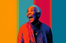 A smiling elderly woman with short white hair is depicted in vibrant, multicolored lighting, standing against a background of vertical stripes in orange, teal, red, and blue. She looks joyful and expressive.