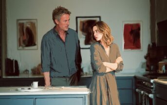 A man and a woman in a kitchen having an intense conversation.