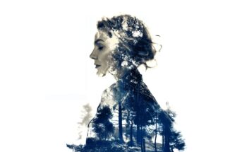Double exposure image of a woman’s side profile blended with a forest scene, creating an artistic effect where trees appear within her silhouette against a white background.
