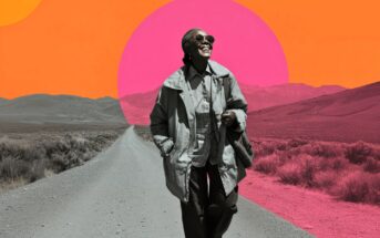 A smiling woman wearing sunglasses and a coat walks down a deserted rural road. The background features grayscale mountains and vibrant, abstract orange and pink sun shapes.