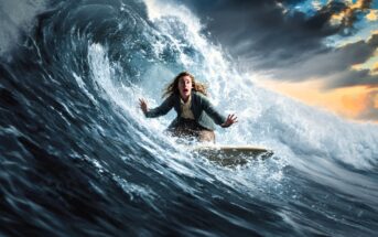 A person with long hair, wearing a jacket and pants, looks surprised while surfing a large, curling wave under a dramatic cloudy sky at sunset.