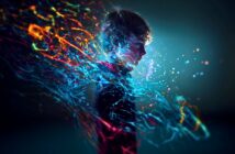 A young boy in profile stands against a dark background, surrounded by vibrant, swirling streams of blue, orange, and pink light, suggesting imagination, energy, or a digital, futuristic effect.
