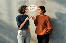 Two women stand facing each other, engaged in conversation. One woman says, "But I'm autistic." Both appear expressive and focused on their discussion. The background is softly blurred.
