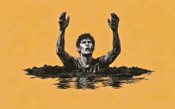 A person up to their chest in mud or dark liquid, with arms raised and hands covered, looking upward against a solid orange background.
