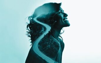 A double exposure image of a smiling woman in profile with a winding road and forest overlaid, symbolizing a journey or path within her silhouette.