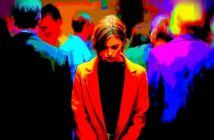 A woman in a red coat stands looking down, surrounded by a blurred crowd. The image is highly colorized with vivid reds, blues, and yellows, creating a dramatic, intense atmosphere.
