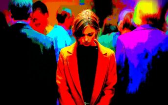 A woman in a red coat stands looking down, surrounded by a blurred crowd. The image is highly colorized with vivid reds, blues, and yellows, creating a dramatic, intense atmosphere.