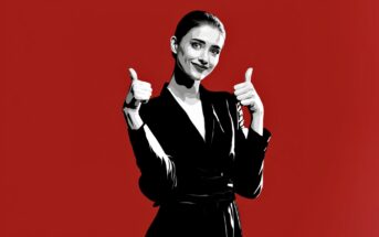 A black and white illustration of a woman in a suit giving two thumbs up, smiling confidently, set against a solid red background.