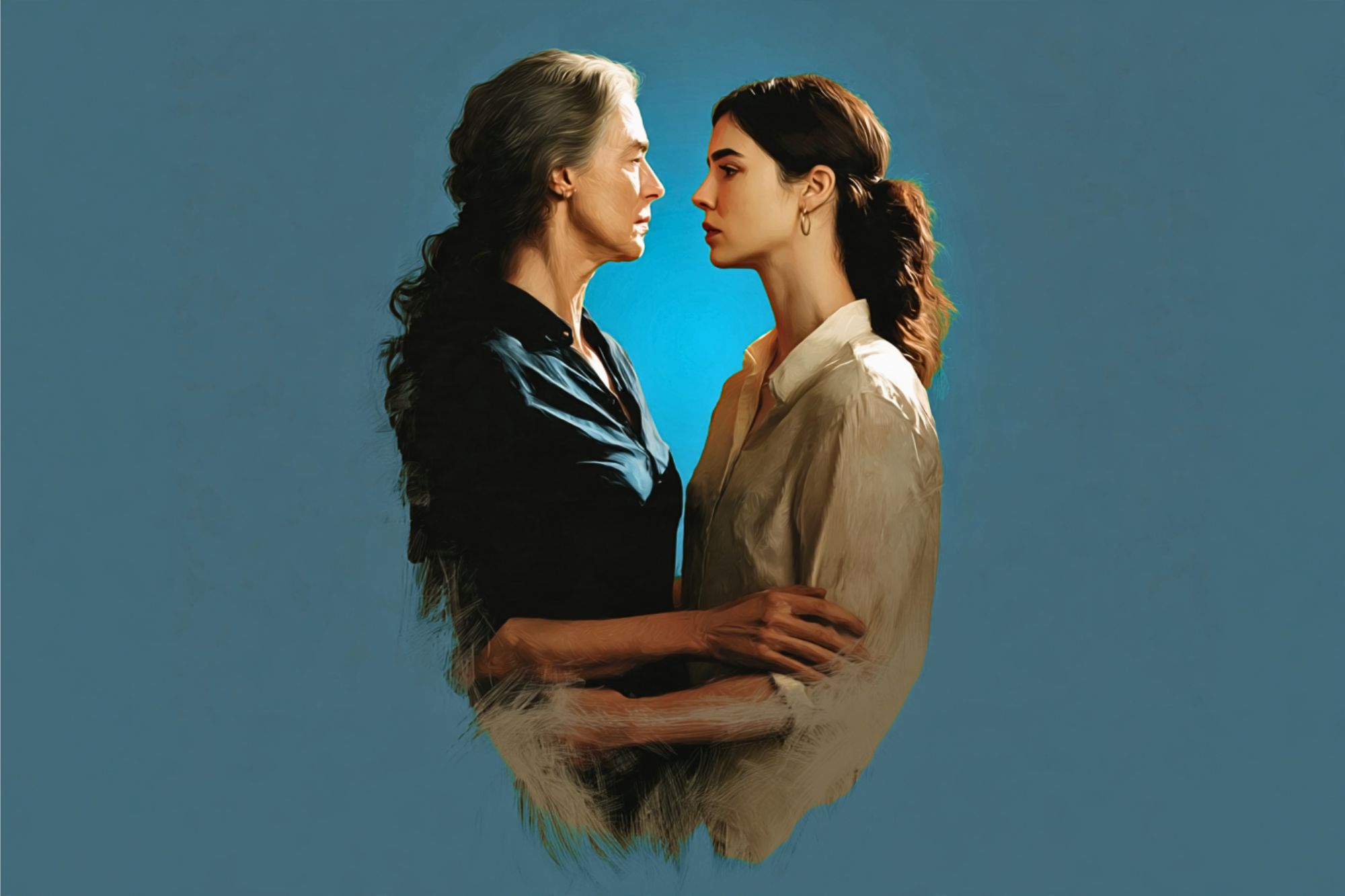 Two women stand closely, facing each other with serious expressions against a blue background. One has gray hair and wears a dark shirt; the other has dark hair and wears a light blouse. They gently hold each other’s arms.