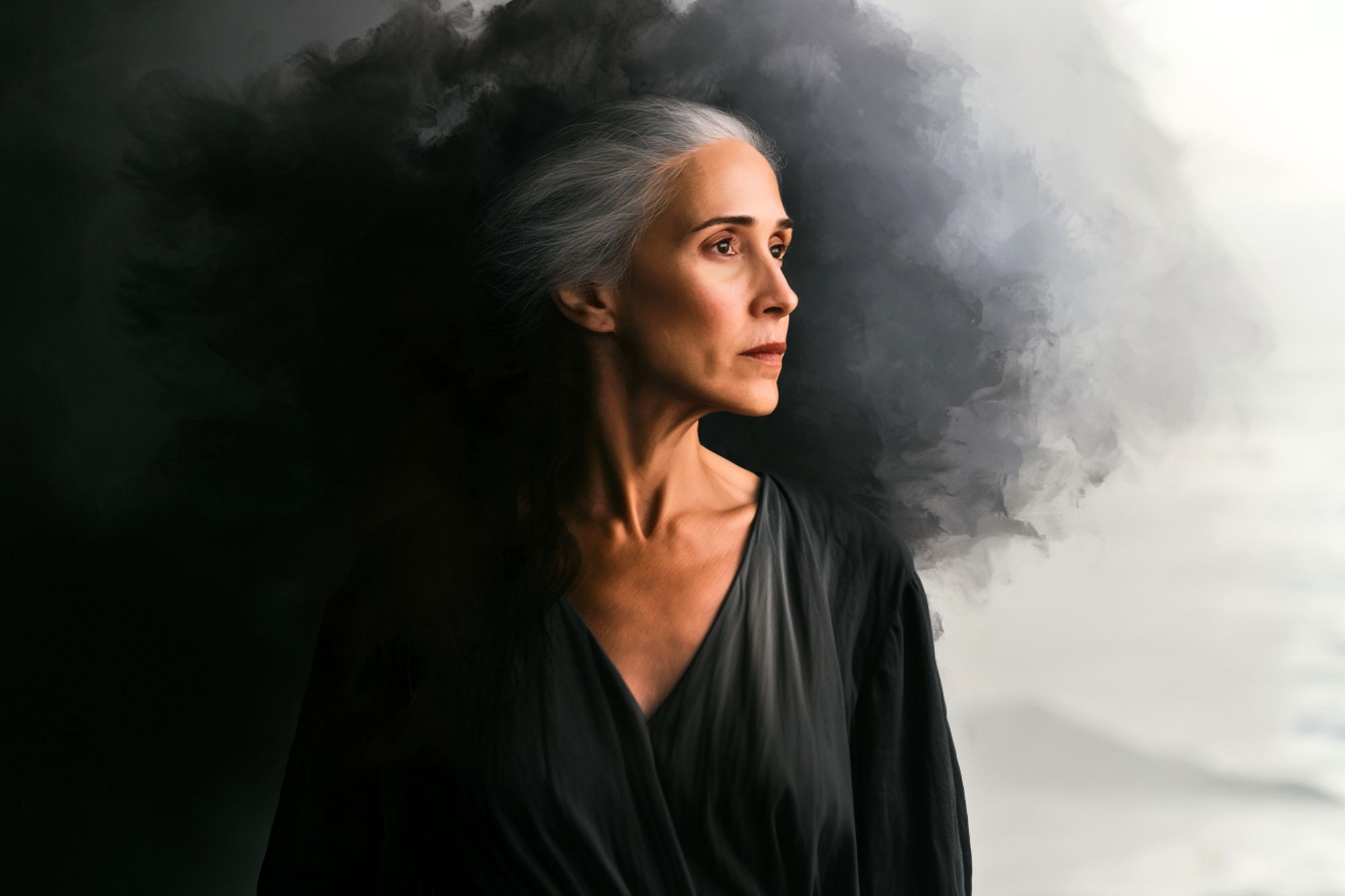 An older woman with long gray hair stands in profile, wearing a dark dress. Dark, smoky clouds swirl dramatically behind her, creating a contrast with the lighter background.