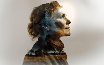 A double exposure image of a woman in profile, overlaid with a landscape of bare trees and a golden field, blending her face with nature elements against a light background.