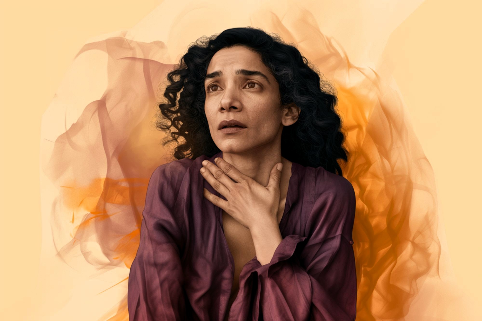 A woman with curly hair wearing a purple top holds her hand to her throat and looks upward with a worried expression, against an abstract orange and yellow background.