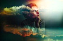 A woman gazes thoughtfully into the distance with her chin resting on her hand. Wispy, colorful clouds are superimposed over her, creating a dreamy, surreal atmosphere with soft light and vibrant hues.