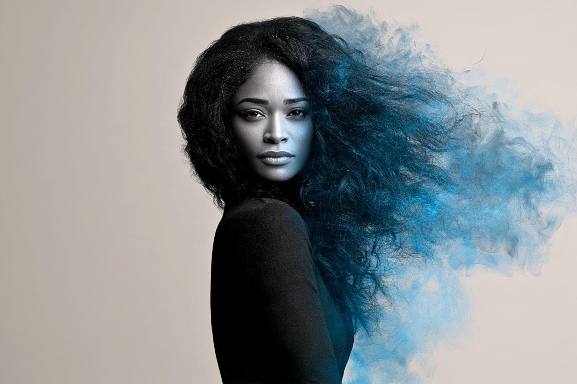 A person with long dark hair that appears to be dissolving into a cloud of blue smoke on one side.