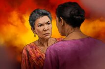 An older woman with short gray hair looks angrily at another woman, whose back is to the viewer. The background is bright orange and yellow, suggesting tension or conflict between them.