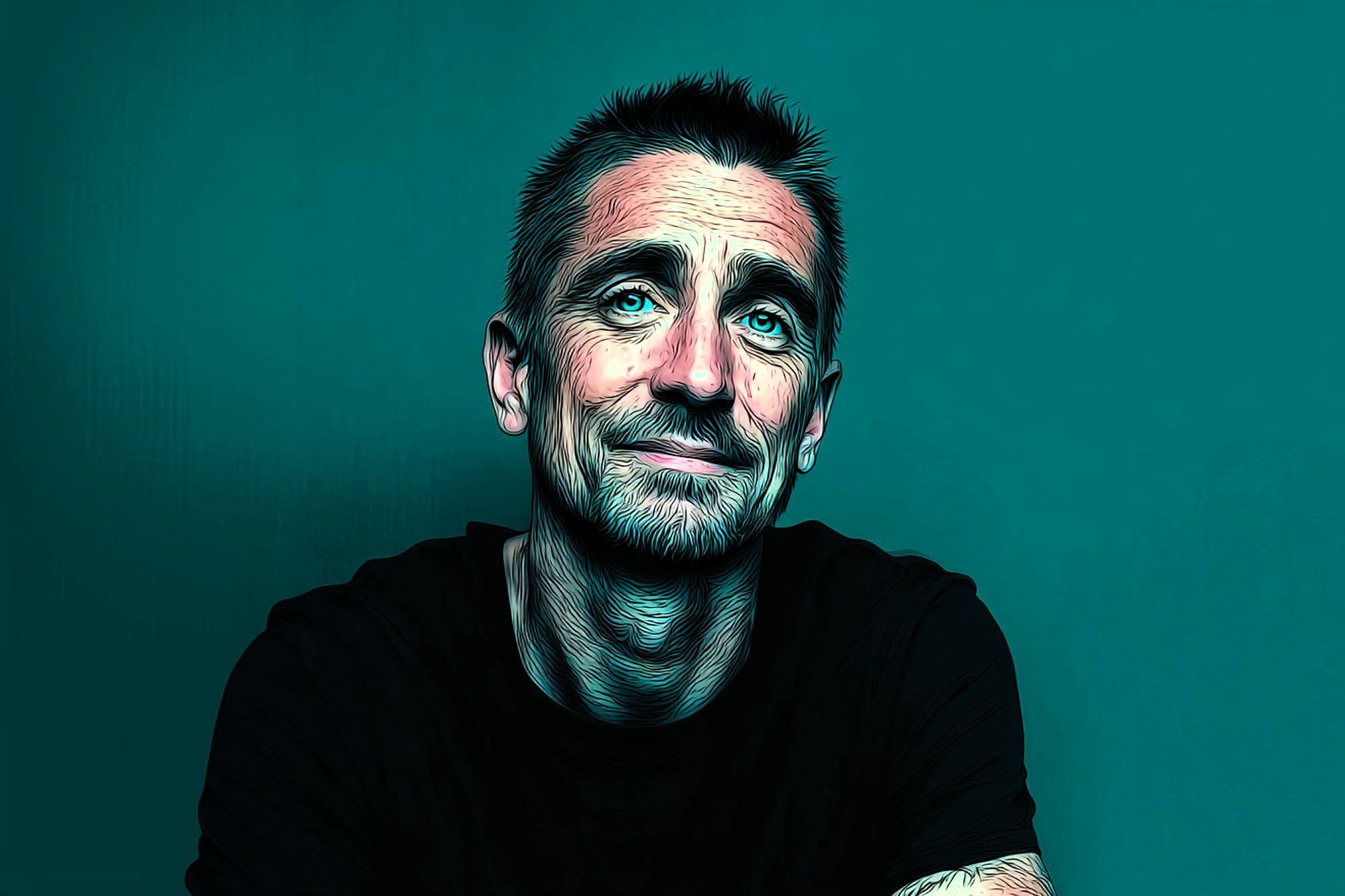 A man with short dark hair, light beard, and mustache wears a black shirt, sitting against a teal background. He is looking slightly up and smiling softly. The image has a digital, artistic filter effect.