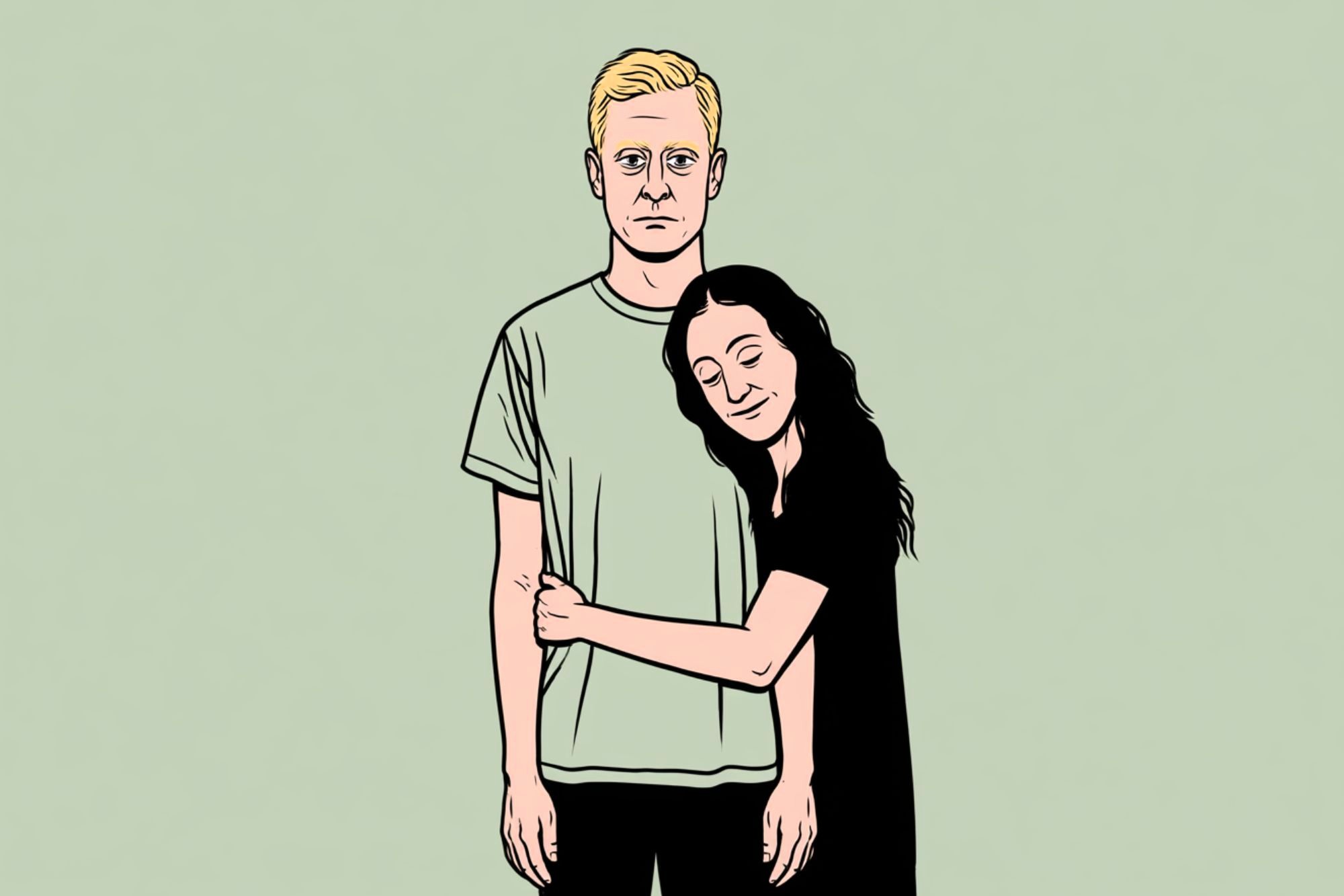 A woman with long dark hair hugs a man with short blond hair. The man stands with a neutral expression while the woman smiles with her eyes closed, leaning her head on his shoulder. The background is pale green.