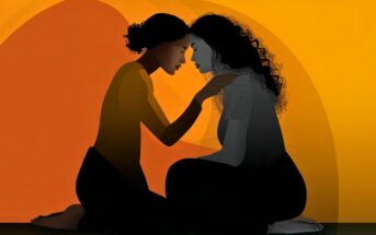 Two women sit facing each other, touching foreheads gently. One comforts the other by holding her shoulders. The background is an abstract blend of warm oranges and yellows.