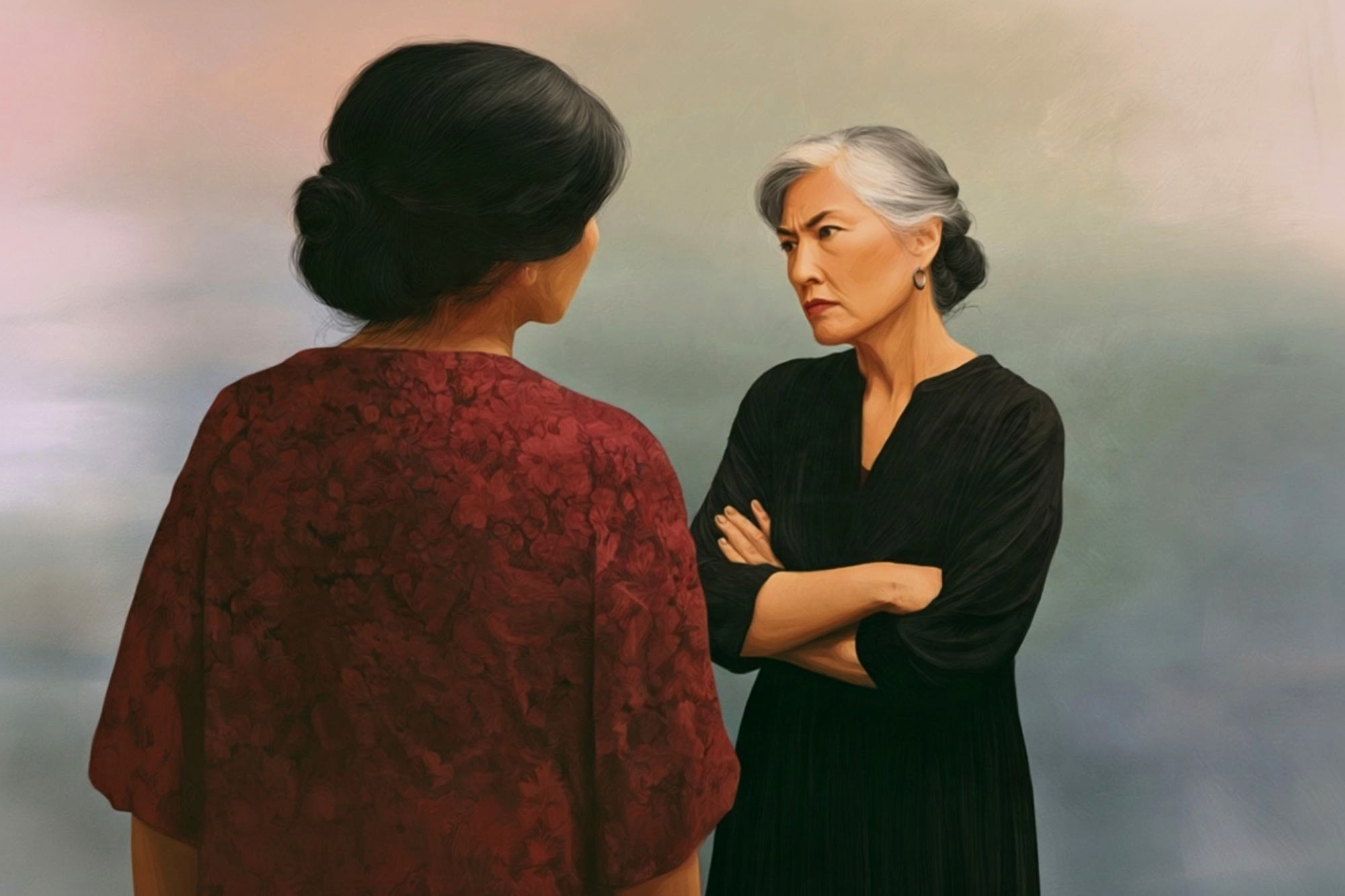Two women stand facing each other. One, with gray hair in a bun and arms crossed, looks stern. The other, seen from behind, wears a red patterned dress. The background is soft and muted.