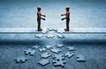 Two faceless figures stand on opposite sides of a broken bridge made of puzzle pieces.