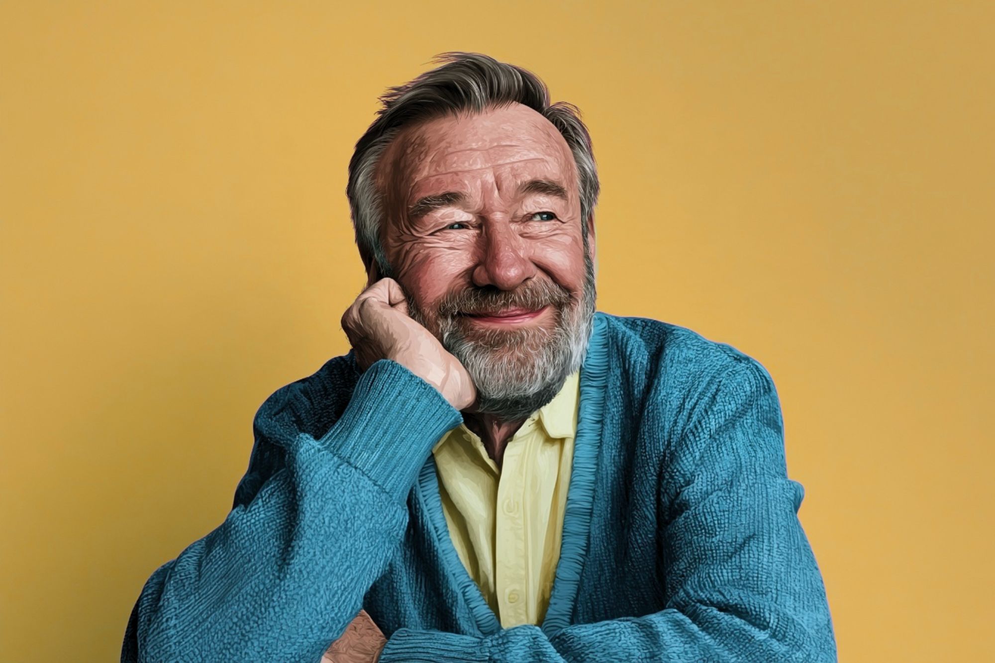 A smiling older man with a grey beard rests his chin on his hand, looking off to the side against a yellow background.